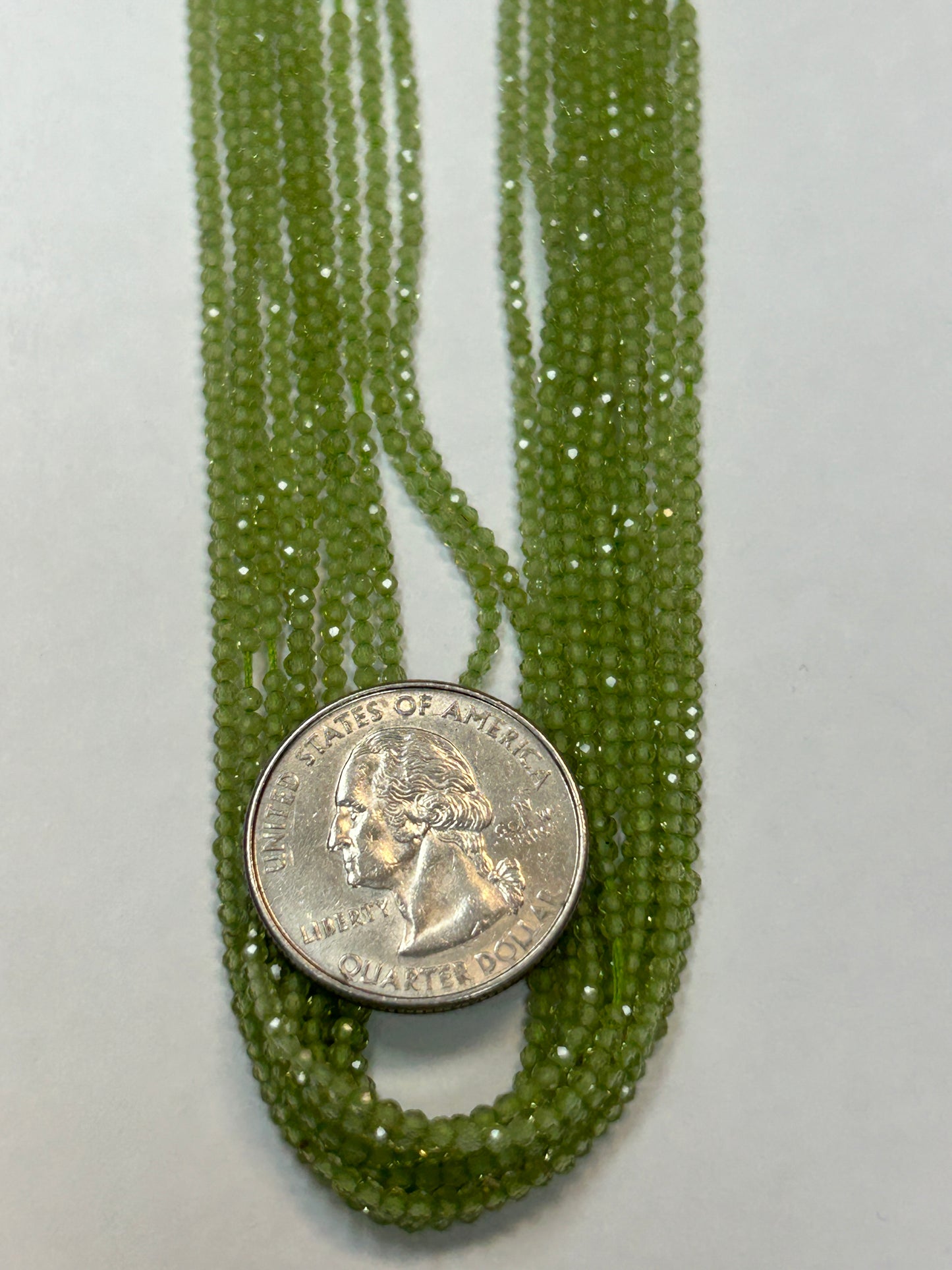 PERIDOT ROUND FACETED 2-3mm