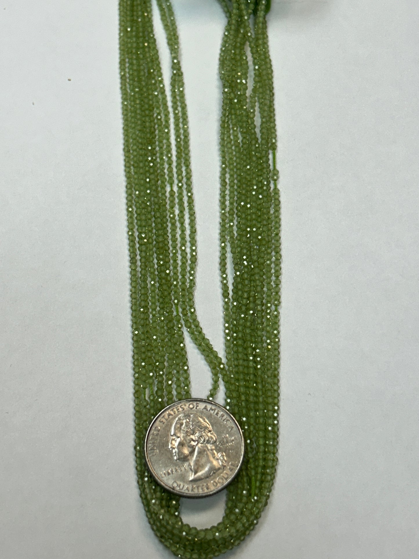 PERIDOT ROUND FACETED 2-3mm