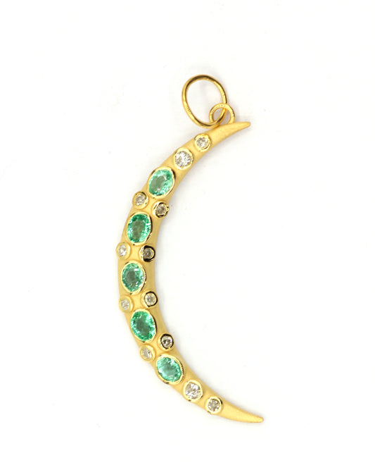 A 14k gold diamond pendant featuring a chain-like design with emerald-colored stones.