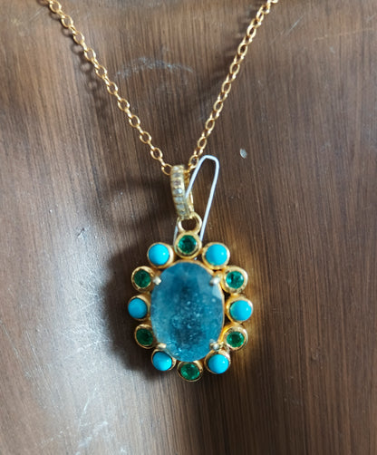 Oval Aquamarine stone pendant in 925 silver with pave diamonds, turquoise and emerald accents, 25x20 mm.