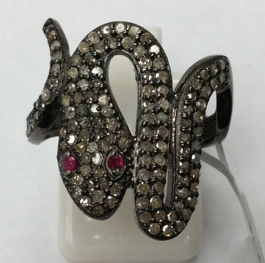 A sterling silver ring with a snake-like design, adorned with pave diamonds