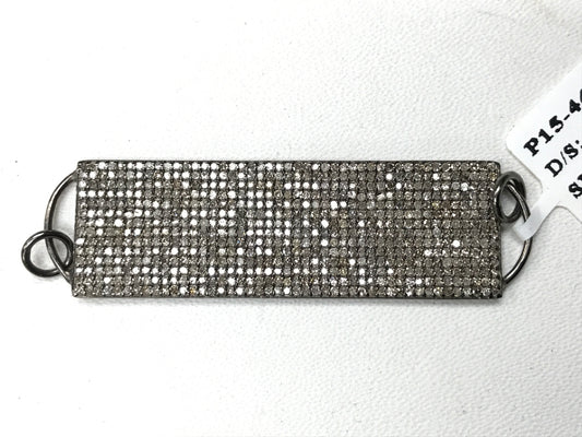 A rectangular diamond pendant with a silver setting and a chain loop at the back, tagged with 'P15-4479'.
