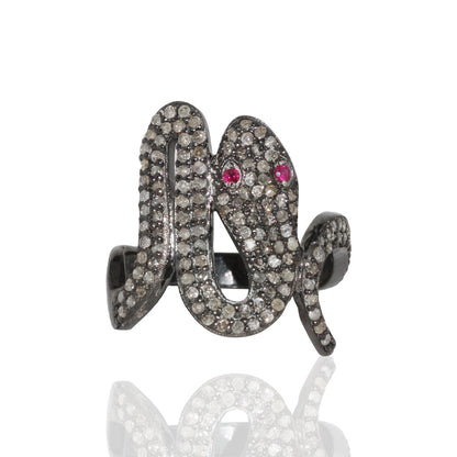 A sterling silver ring with a snake-like design, adorned with pave diamonds